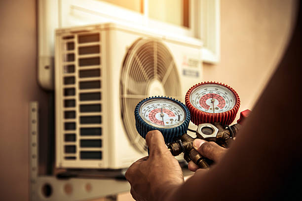 Professional Heat Pump Repair technician working in Athens, OH